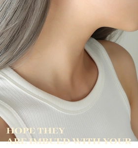 Close-up of white ribbed tank top neck area showing detailed vertical knit texture and soft cotton