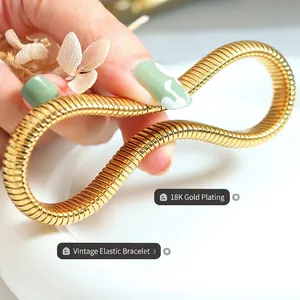 Vintage style elastic bangle plated in 18K gold featuring a flexible snake bone structure