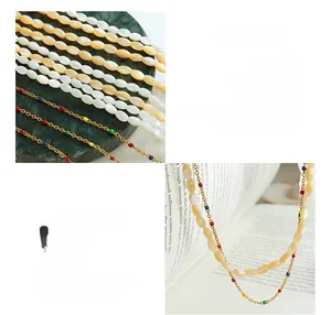 Detail of vintage titanium steel necklace with shell beads and colorful drip oil accents