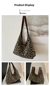 Detail view showing leopard print tote bag with brown straps and large interior capacity