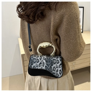 Vintage leopard print handbag with gold metal handle and black leather details for women