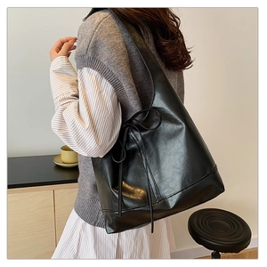 Large black glossy PU leather tote bag with side bow detail for women's daily commute