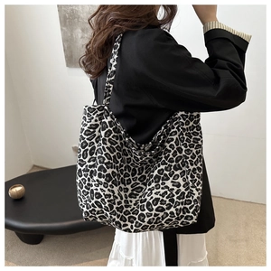 Large capacity leopard print tote bag for women showing spacious shoulder carry style