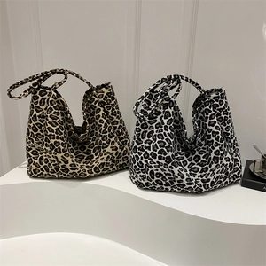 Large leopard print canvas tote bags in brown and grey with dual shoulder straps