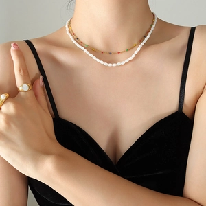 French retro double-layer shell necklace and gold rings set worn by a model