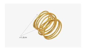 Detail shot of multi-layer spiral gold ring showing 1.8cm diameter and polished finish