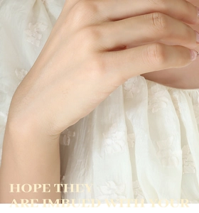 Detail of white shirt featuring delicate 3D butterfly jacquard and sheer silk fabric