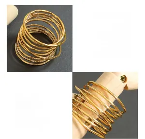 Macro detail of multi-layer gold brass spring ring showing coiled metal texture
