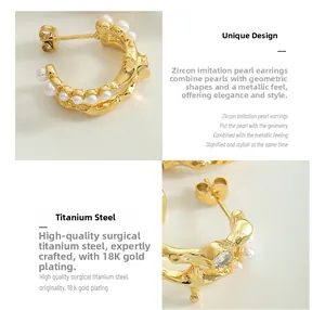 Macro view of C-shaped 18K gold plated earrings with micro pearls and round zircon stones