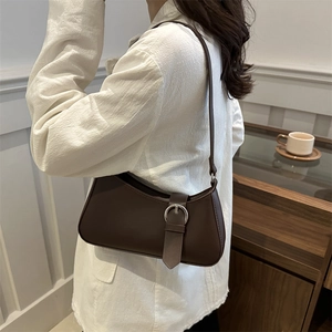 Chic dark brown faux leather crescent underarm bag with silver ring buckle detail