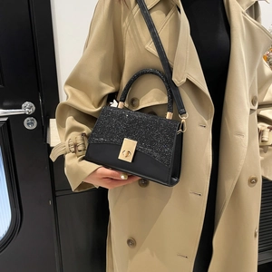 Elegant black sequin patchwork handbag with gold metal lock and shoulder strap