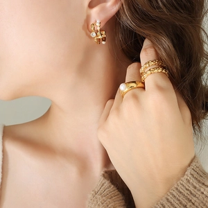 French retro gold irregular C-shape earrings with pearls and zircon on model