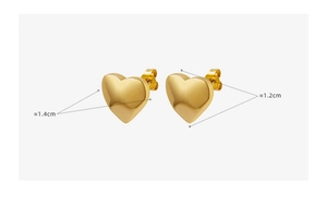 Detail view of heart-shaped gold stud earrings with size labels 1.4cm and 1.2cm