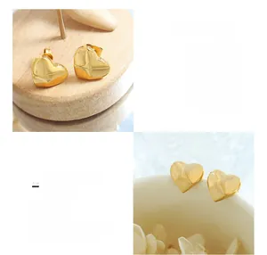Detailed macro view of 18K gold-plated titanium steel heart-shaped stud earrings