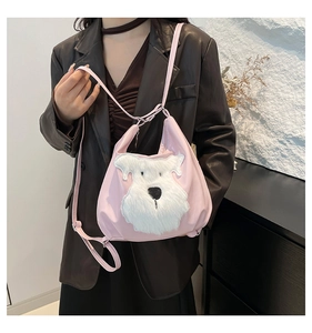 Detailed close-up of a pink tote bag featuring a fluffy white dog patch on soft PU leather