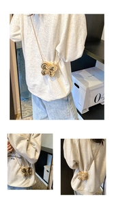 Detailed views of the golden butterfly-shaped mini crossbody bag with a metal chain strap