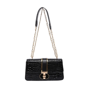 Glossy black crocodile-embossed flap bag with gold T-shaped lock and chain strap
