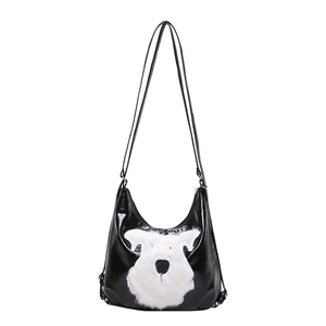 Minimalist black shiny leather hobo tote with white plush dog design for women