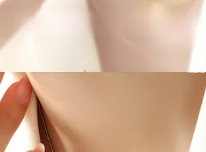 Close-up of minimalist layered golden blade necklace chain on model neck