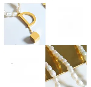 Detail of 18k gold plated titanium steel D-letter pendant with freshwater pearl chain
