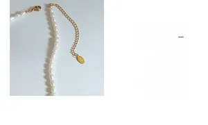 Detail of freshwater pearl necklace with gold lobster clasp and adjustable extension chain