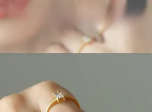 Detailed close-up of a minimalist gold ring featuring a rectangular zircon stone inlay