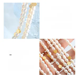 Macro detail of freshwater pearl necklace with 18K gold plated surgical steel beads