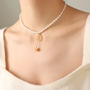 French style pearl necklace featuring a gold letter D pendant and minimalist cube tassel
