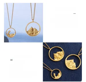 Detailed relief of mountains and waves on 18K gold plated titanium couple necklaces