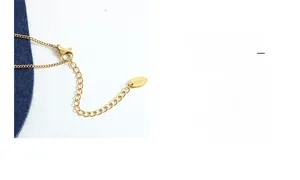 Detail of gold chain necklace featuring lobster clasp, extension and X18 tag