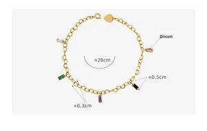 Detail of gold titanium bracelet with colorful zircon stones and heart charm link