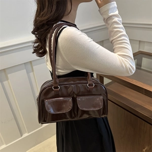 Retro brown polished leather shoulder bag with double pockets shown on model