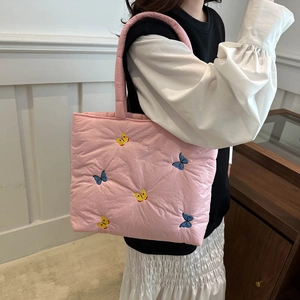 Pink quilted tote bag with butterfly embroidery and lightweight nylon finish for women