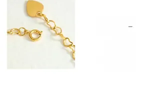 Detail of gold-plated titanium steel bracelet with heart charm and secure spring clasp