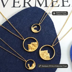 Four gold titanium steel necklaces with mountain textured circular pendants and chain detail