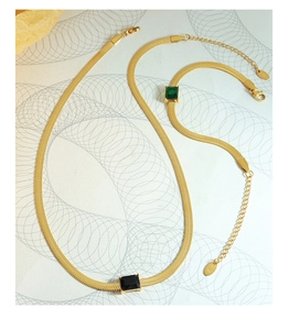 Detail of K18 gold plated blade chain set with black and green rectangular gemstones