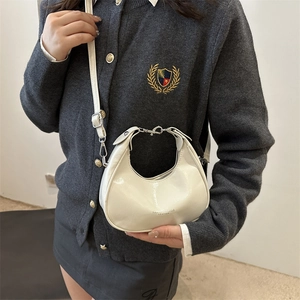 Chic white crescent hobo bag for women with silver hardware and adjustable strap