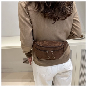 Brown corduroy waist bag shown from a back-view perspective on a person for casual style