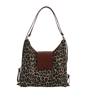 Leopard print canvas tote bag with brown leather hobo shoulder strap and snap closure