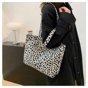 Close-up of stylish leopard print tote bag with soft canvas texture and large capacity