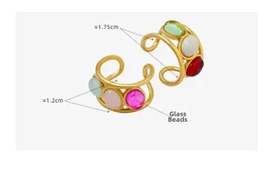Detail view of gold metal rings with colorful oval glass beads and size measurements
