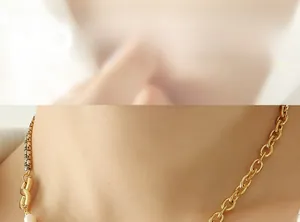 Detail of trendy gold necklace with black cubic zirconia and pearl split design
