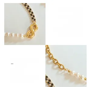 Close-up of geometry chain necklace with freshwater pearls and zircon infinity buckle