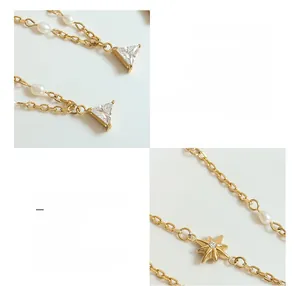 Dettaglio pendente a stella e perla d'acqua dolce su collana in acciaio titanio placcato oro 18K