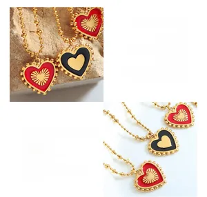 Macro shot of titanium steel necklace with red and black double-sided heart pendant