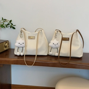 Minimalist corduroy bucket tote bags with plush cloud charms and contrast leather straps
