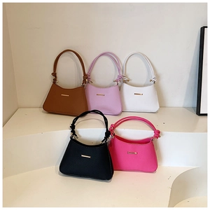 Collection of retro minimalist underarm bags in five colors with woven handles and gold accents