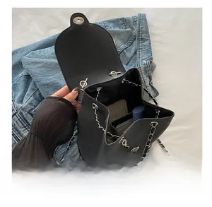 Interior view showing the large capacity of the black leather chain bucket bag