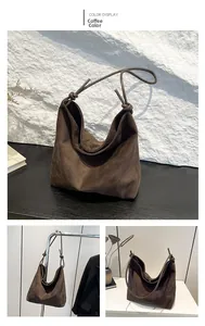 Detail of coffee brown suede tote bag featuring a minimalist knot handle design