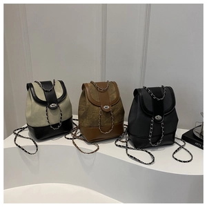 Three mini chain backpacks in beige, brown and black with metal turn-lock closure